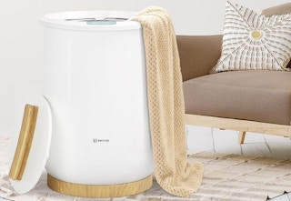 towel bucket beside couch