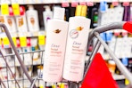 dove shampoo and conditioner in a cart
