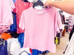 Pink Athletic Works Buttercore Cropped Tee held up in Walmart store