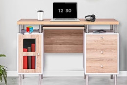 Lifestyle image of the Homestock Desk with Keyboard Tray and USB Charging Station
