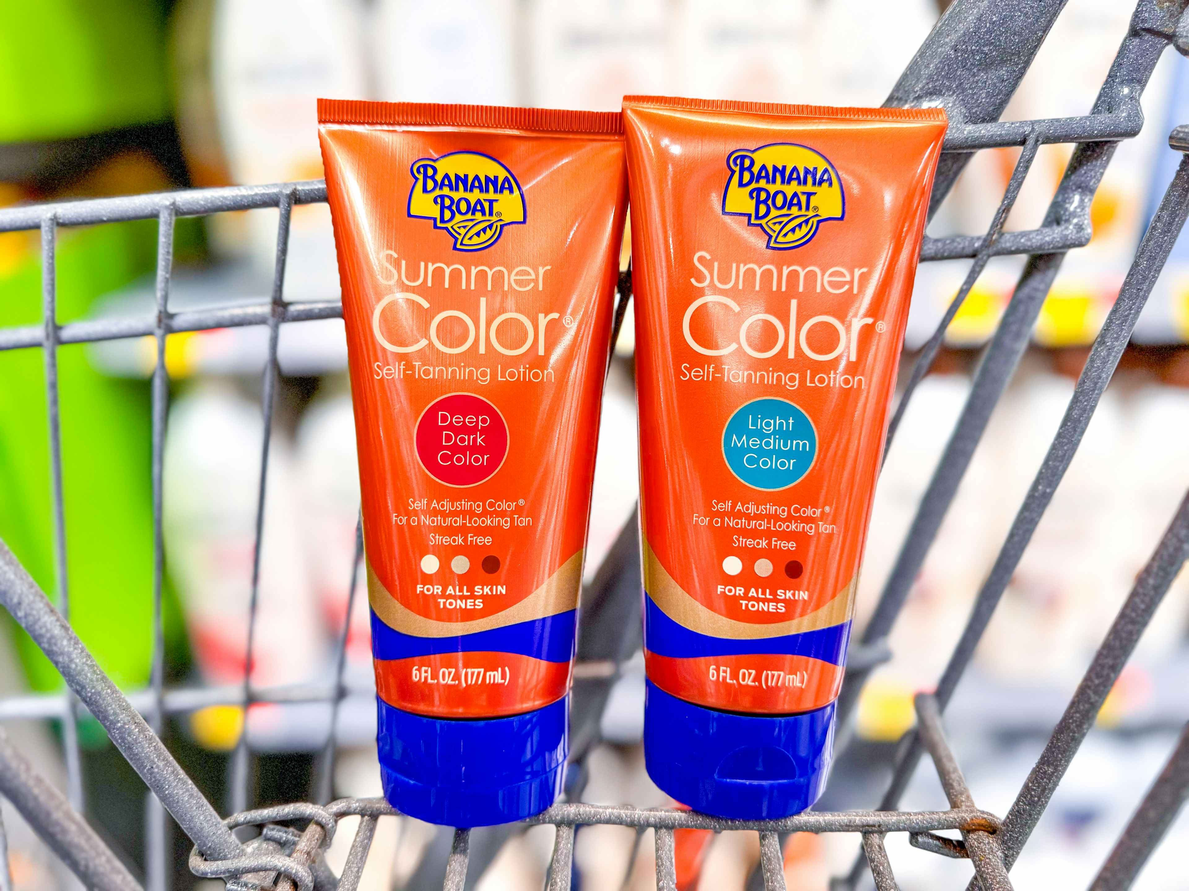 2 bottles of banana boat tanning lotion in a cart