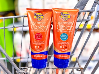 2 bottles of banana boat tanning lotion in a cart