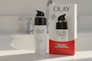 olay bottle and box on bathroom sink