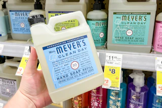 hand holding mrs meyers hand soap refill