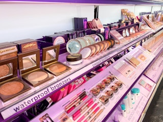 A view down the aisle of the Tarte brand makeup section inside Sephora.
