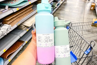 Simply Modern Water Bottle held over Walmart shopping cart