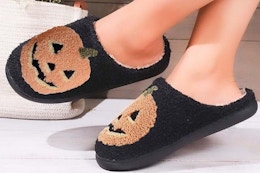 halloween slippers on a woman
