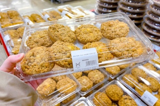 hand holding a pack of members mark crumb cakes