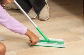 a mopping cloth being put on a Swiffer 