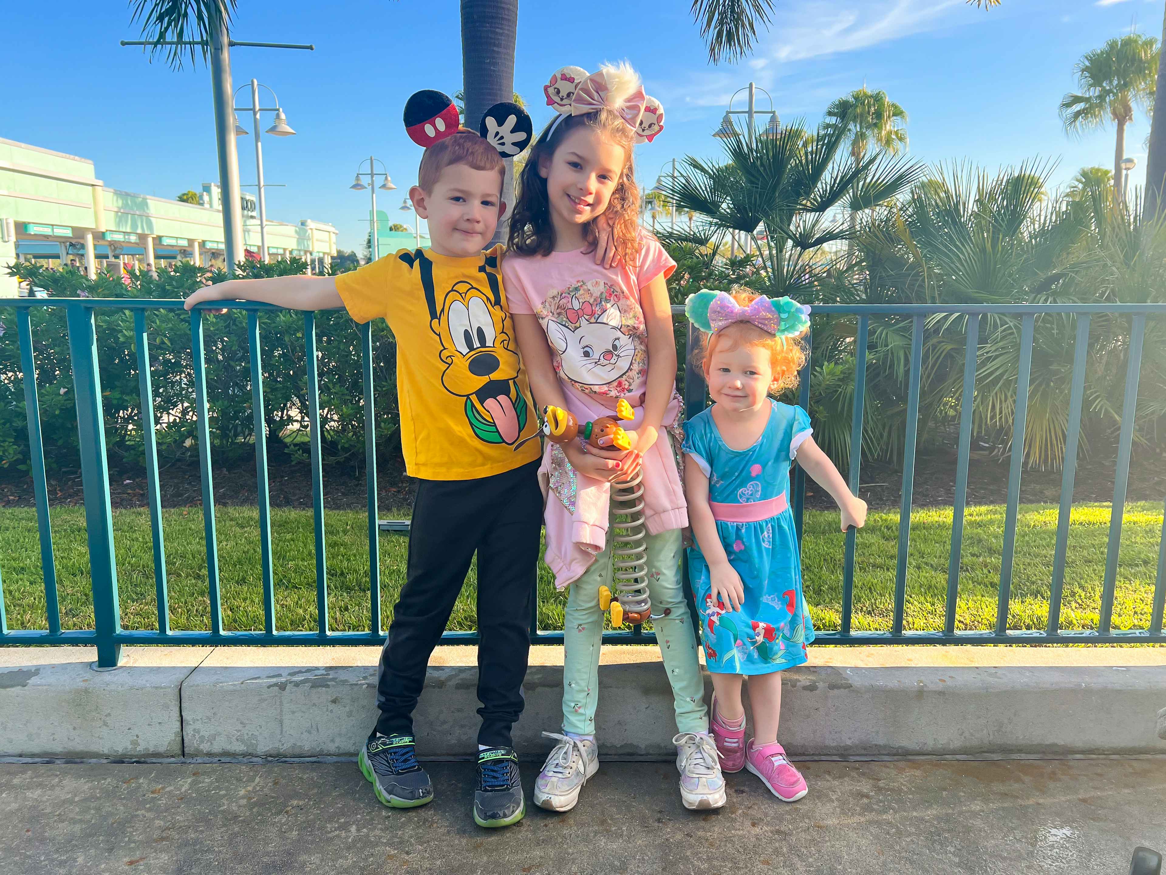 children with mouse ears at disney world