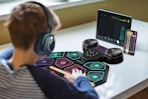 a kid playing with a drum set