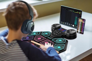 a kid playing with a drum set