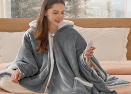 a person wearing a heated hoodie blanket