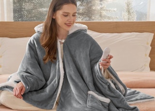a person wearing a heated hoodie blanket