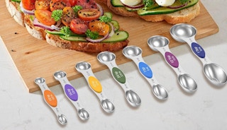magnetic spoons laid out on a cutting board 