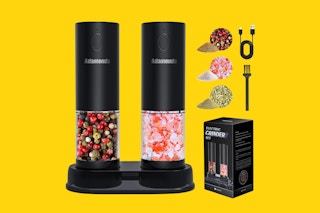 A salt and pepper grinder set with a stand on a yellow background with pictures of the box, brush and ground spices.