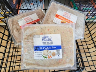 bags of fresh frozen dog food in a cart