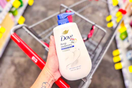 hand holding dove body wash over cvs shopping cart