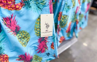 close up of us polo association mens swim trunks on walmart clothing aisle end cap