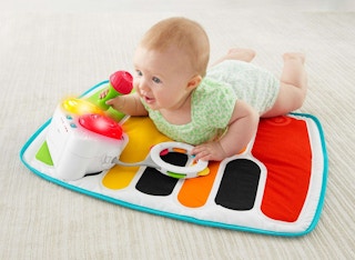 stock photo of fisher-price baby bouncer piano mat