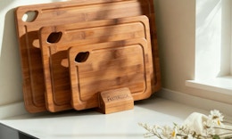 3 bamboo cutting boards on a counter 