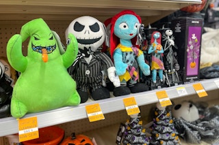 orange clearance tags on a shelf with nightmare before christmas toys