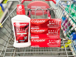 one bottle of Colgate Mouthwash and three Colgate StainFighter toothpaste inside shopping cart