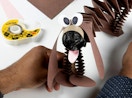 a roll double-sided tape next to a paper dog project