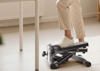 a person on a mini stepper