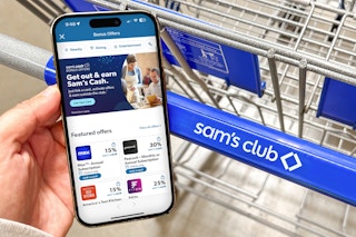 someone holding their phone displaying the sam's club app page for bonus offers