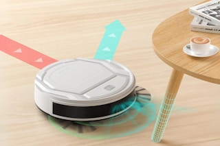 A Lefant robot vacuum cleaner moves across a hardwood floor and senses a table leg in its way.