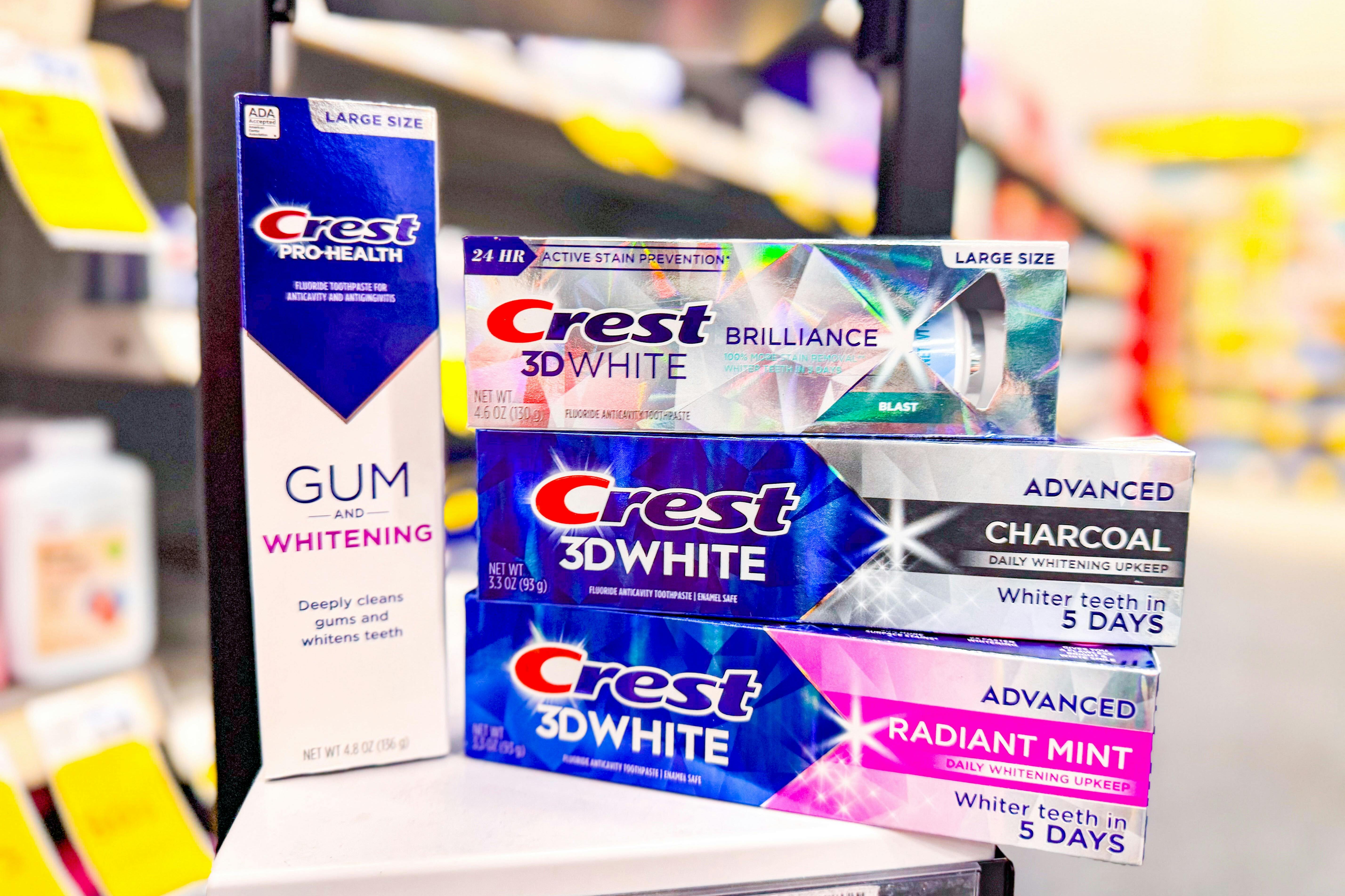 4 tubes of crest toothpaste on a shelf