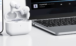 earbuds next to a laptop 
