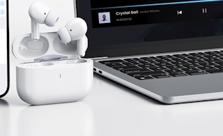 earbuds next to a laptop