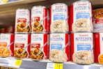 campbell's kitchen classics soup stacked on store shelf