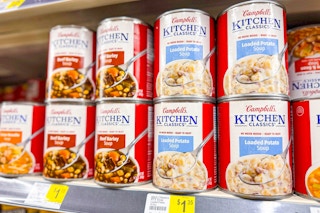 campbell's kitchen classics soup stacked on store shelf