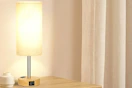 a bedside lamp on a table