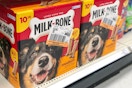 a shelf with boxes of dog treats