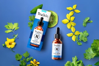TruSkin Retinol Serum on a blue background