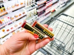 hand holding milani lipsticks in walgreens