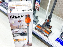 shark rocket stick vacuum sitting in front of vacuum display at target