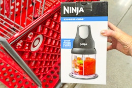 hand holding ninja-express-chop in front of target cart