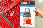 hand holding ninja-express-chop in front of target cart