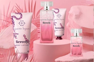 4 piece perfume set on a pink background