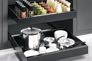 Black steel cabinet organizer, extended to 19.6 in. Spices and dishes are stored there.