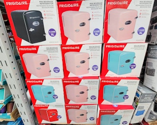 display of mini beverage refrigerators in black, pink, and teal