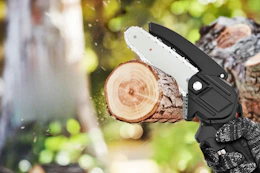 Lifestyle image of a mini chainsaw being used to cut a tree branch
