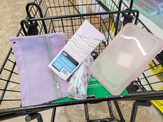 various pencil pouches and cases in a cart