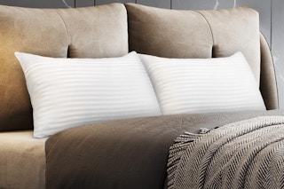 COZSINOOR Bed Pillows for Sleeping Queen Size on a made bed.