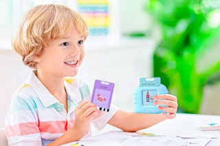 Lifestyle image of boy using the talking flash card learning system